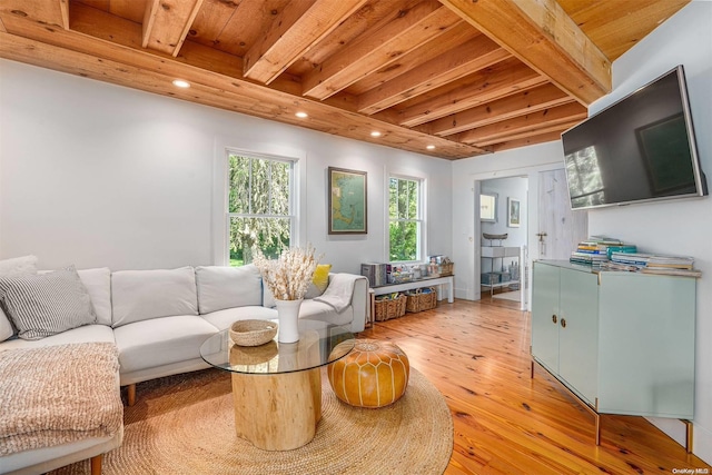 living room with beam ceiling, wood ceiling, and hardwood / wood-style flooring