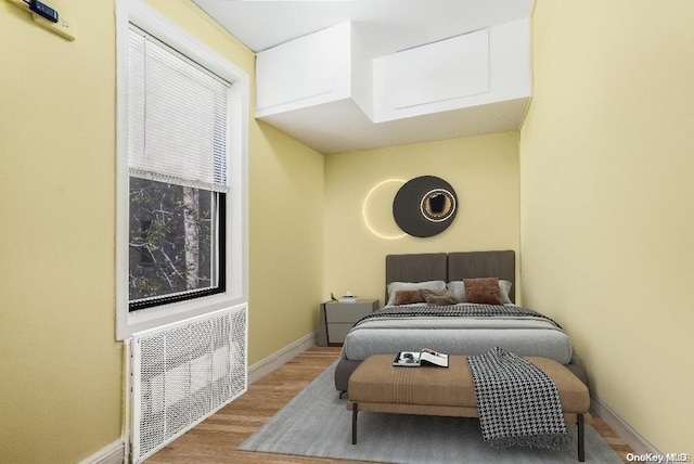 41-12 41st St Unit 3-H, Sunnyside, NY 11104 - bedroom with wood finished floors and baseboards