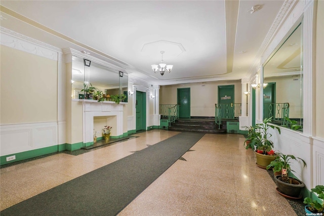41-12 41st St Unit 3-H, Sunnyside, NY 11104 - community lobby featuring a decorative wall, wainscoting, and crown molding