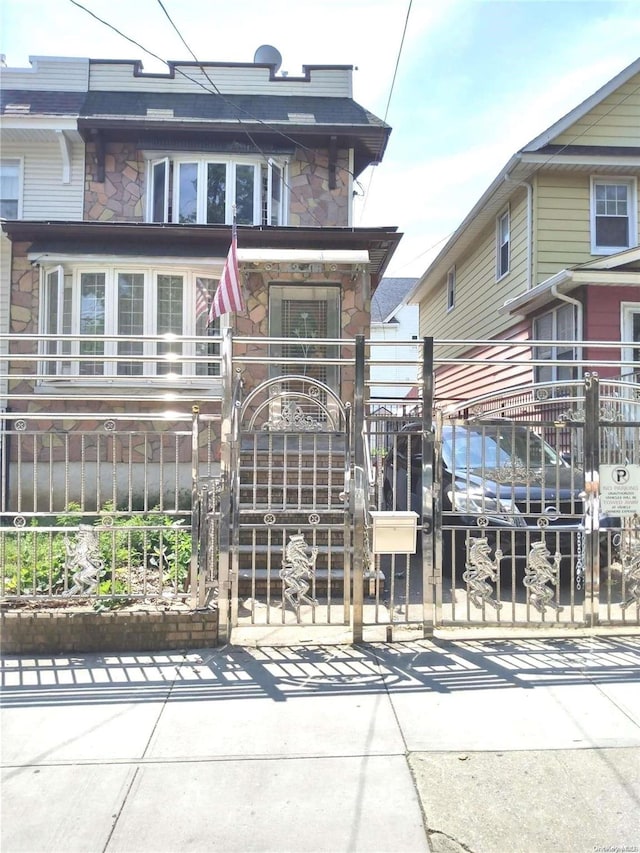 rear view of house featuring solar panels and a balcony