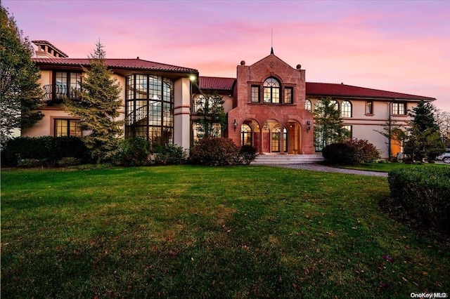 view of front of home with a yard