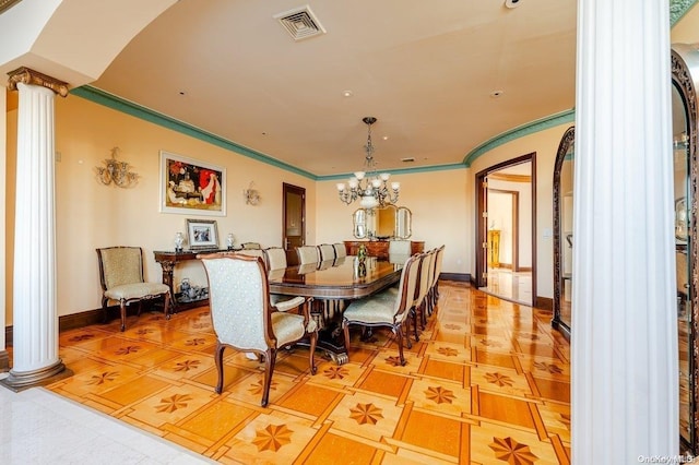 tiled dining space featuring ornate columns, a chandelier, and ornamental molding