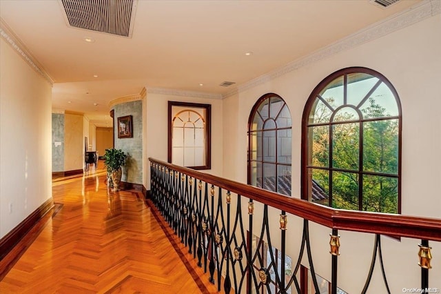 hall featuring crown molding and parquet flooring