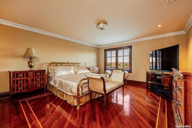 bedroom with hardwood / wood-style flooring and ornamental molding