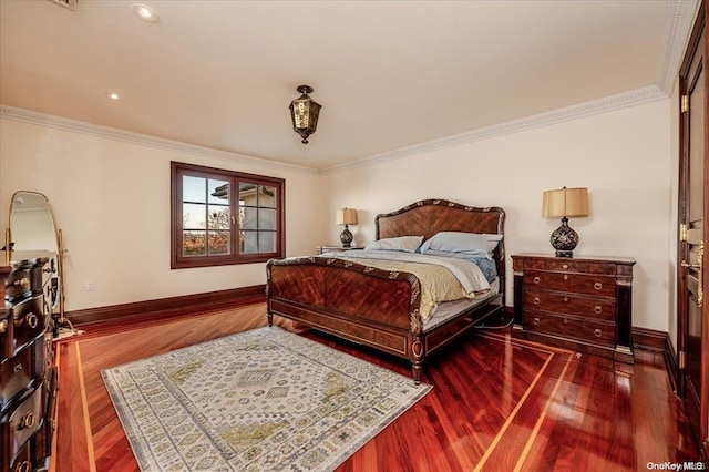 bedroom with crown molding and hardwood / wood-style floors