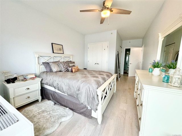 bedroom with ceiling fan and light hardwood / wood-style flooring