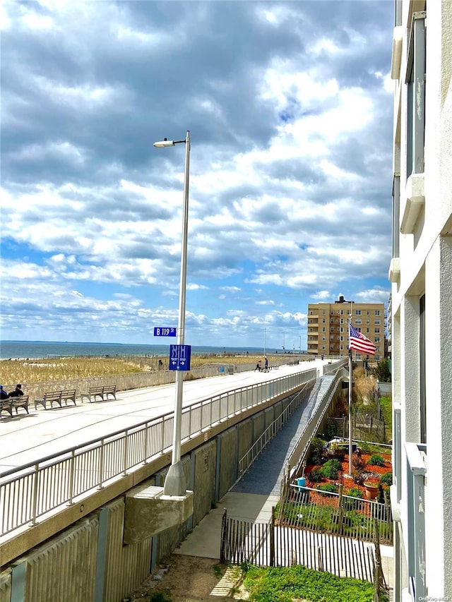 view of home's community with a water view