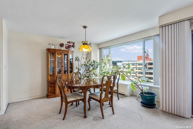 dining space with light colored carpet