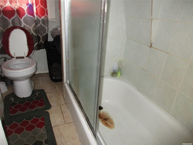 bathroom with tile patterned flooring and toilet