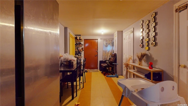 hallway with light tile patterned flooring