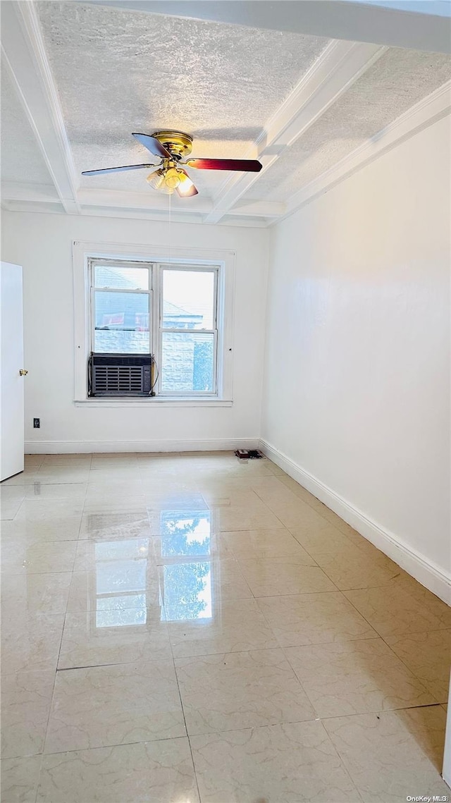 spare room featuring ceiling fan, ornamental molding, and a textured ceiling