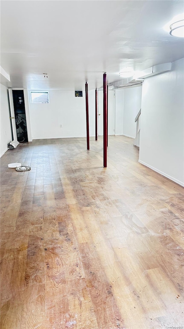 basement featuring light hardwood / wood-style flooring