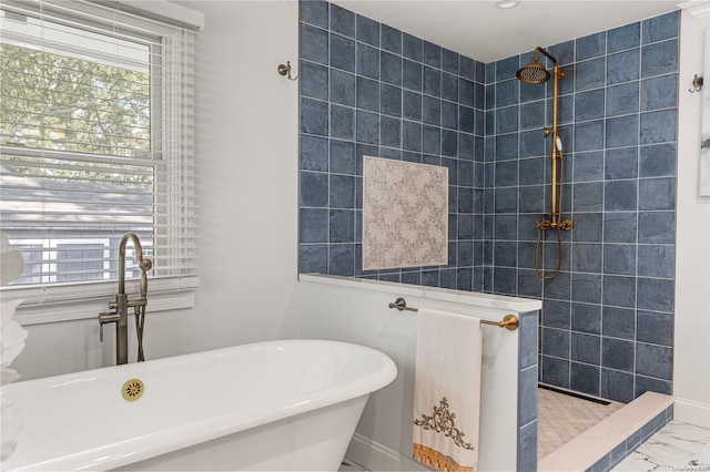 bathroom featuring shower with separate bathtub