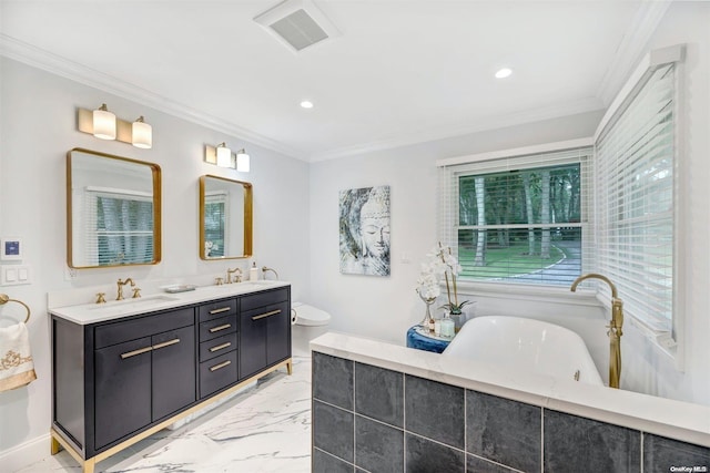 bathroom featuring vanity, a bathtub, and crown molding