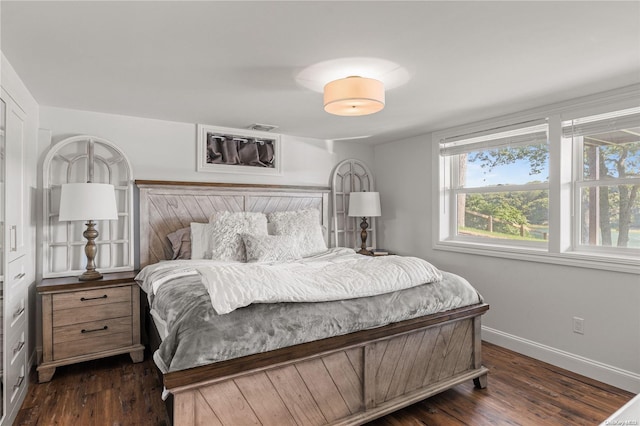 bedroom featuring dark hardwood / wood-style floors