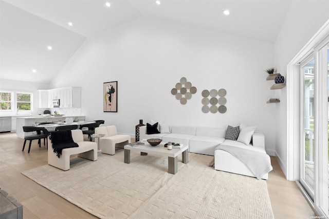 21 Montauk Hwy Unit 5, Westhampton, NY 11977 - living area with high vaulted ceiling, light wood-type flooring, and recessed lighting