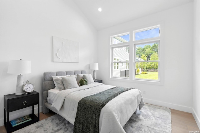 21 Montauk Hwy Unit 5, Westhampton, NY 11977 - bedroom featuring wood finished floors, baseboards, recessed lighting, and high vaulted ceiling