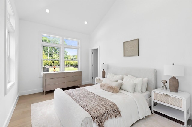 21 Montauk Hwy Unit 5, Westhampton, NY 11977 - bedroom featuring baseboards, light wood-type flooring, high vaulted ceiling, and recessed lighting