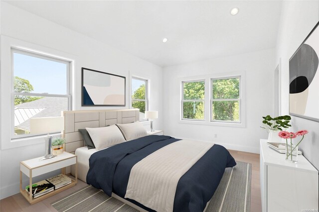 21 Montauk Hwy Unit 9, Westhampton, NY 11977 - bedroom with wood finished floors, recessed lighting, and baseboards