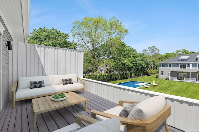 21 Montauk Hwy Unit 9, Westhampton, NY 11977 - wooden terrace with an outdoor living space, a yard, and a swimming pool