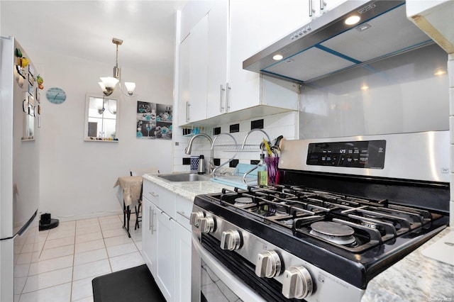 kitchen featuring white cabinets, decorative backsplash, exhaust hood, and stainless steel range with gas stovetop