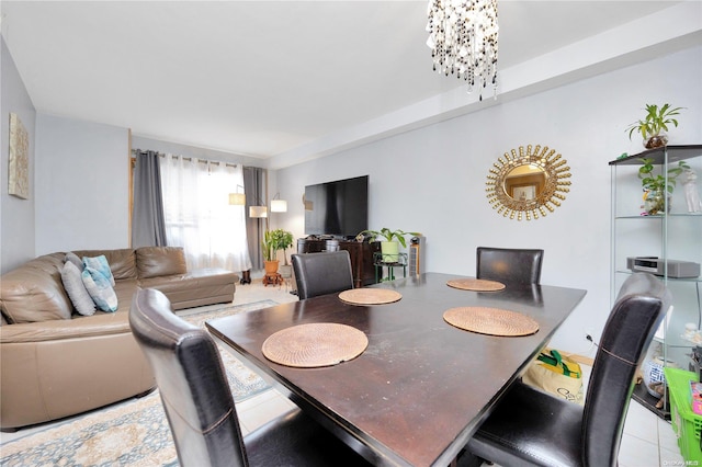 dining area with an inviting chandelier