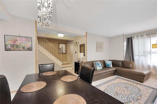 dining room featuring a notable chandelier and light tile patterned floors