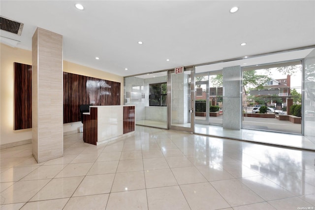 99-40 63rd Rd Unit 9Z, Rego Park, NY 11374 - kitchen featuring modern cabinets, recessed lighting, light tile patterned flooring, and a kitchen island