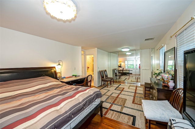 bedroom with hardwood / wood-style flooring