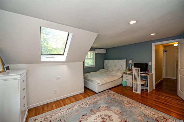 bedroom with hardwood / wood-style floors, vaulted ceiling, and a wall unit AC