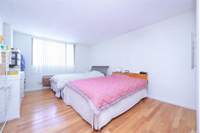 bedroom with light wood-type flooring