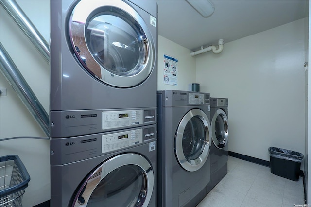 clothes washing area with stacked washing maching and dryer