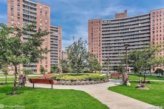 61-55 98th St E Unit 16L, Rego Park, NY 11374 - view of property's community with a yard and a city view