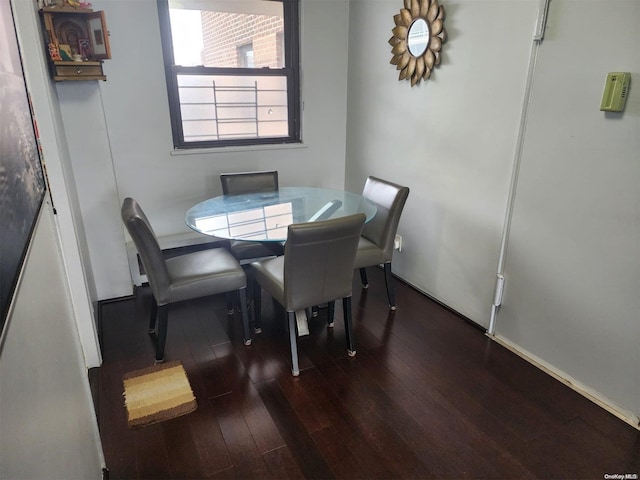 dining area featuring dark hardwood / wood-style floors