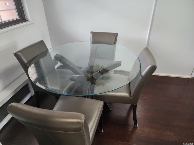 dining space featuring dark hardwood / wood-style flooring