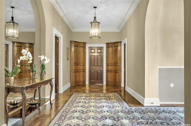 entrance foyer featuring dark hardwood / wood-style flooring and crown molding