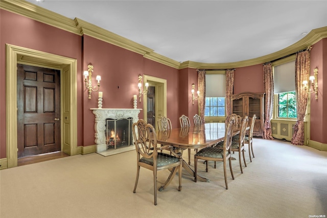 dining space featuring light carpet and crown molding