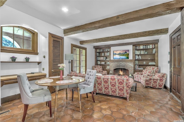 living room featuring a fireplace and beamed ceiling