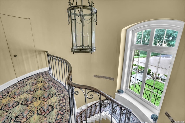 stairway featuring a wealth of natural light