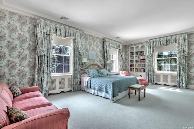 carpeted bedroom featuring multiple windows and ornamental molding