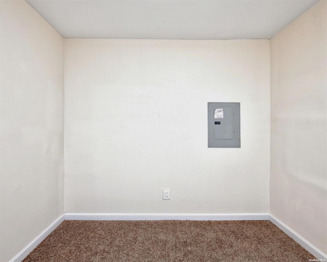 carpeted empty room with electric panel