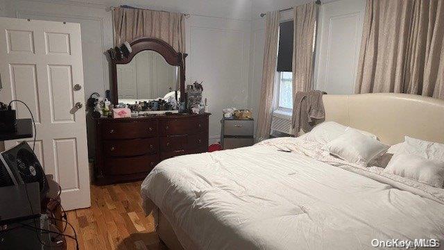 bedroom with wood-type flooring