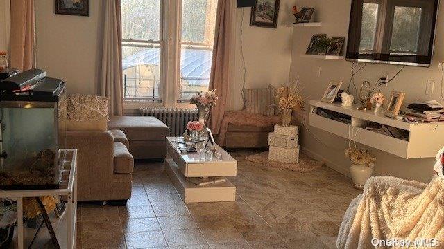 sitting room featuring radiator