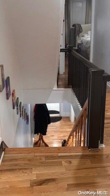 stairway featuring hardwood / wood-style floors