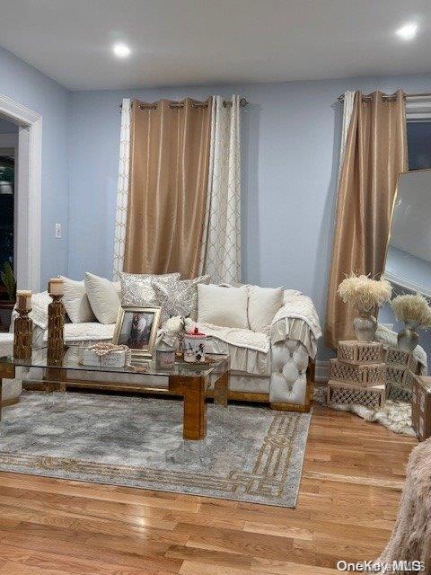 living area with wood-type flooring