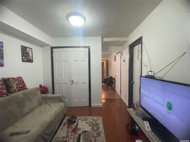 living room with dark hardwood / wood-style flooring