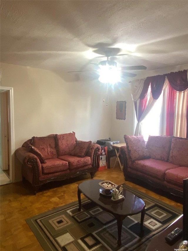 living room with a textured ceiling and hardwood / wood-style flooring