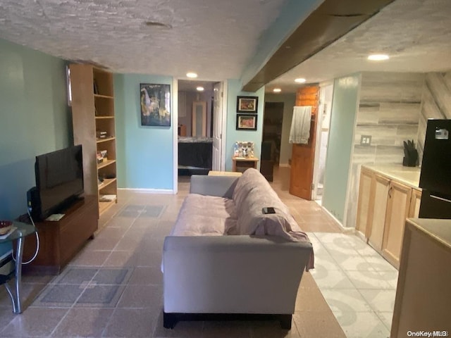 living room featuring a textured ceiling
