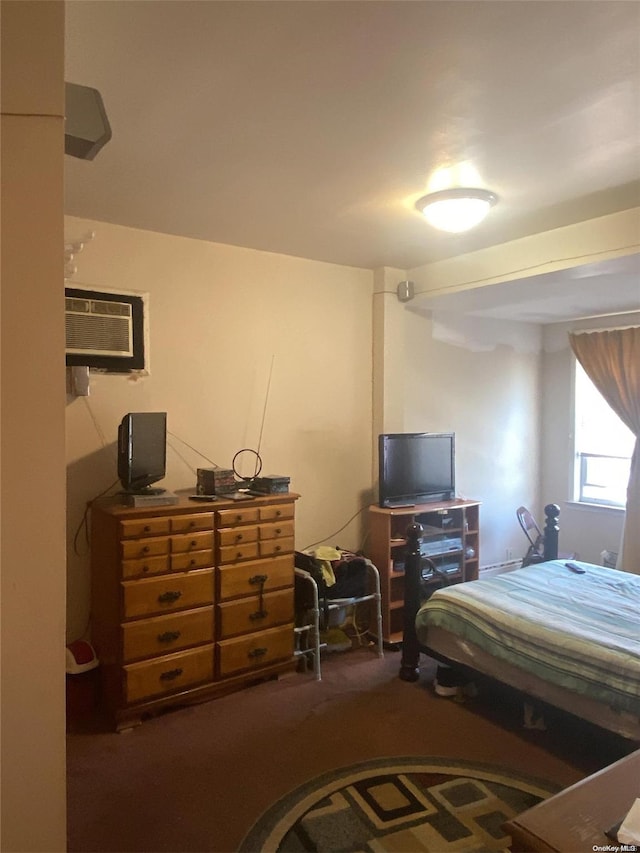 carpeted bedroom with a wall unit AC