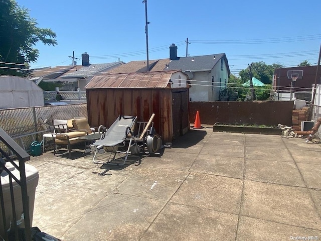 view of patio / terrace with a storage shed